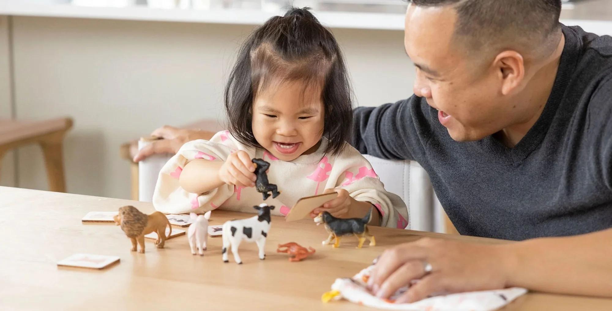 Little girl playing with Montessori Animal Match from The Companion Play Kit